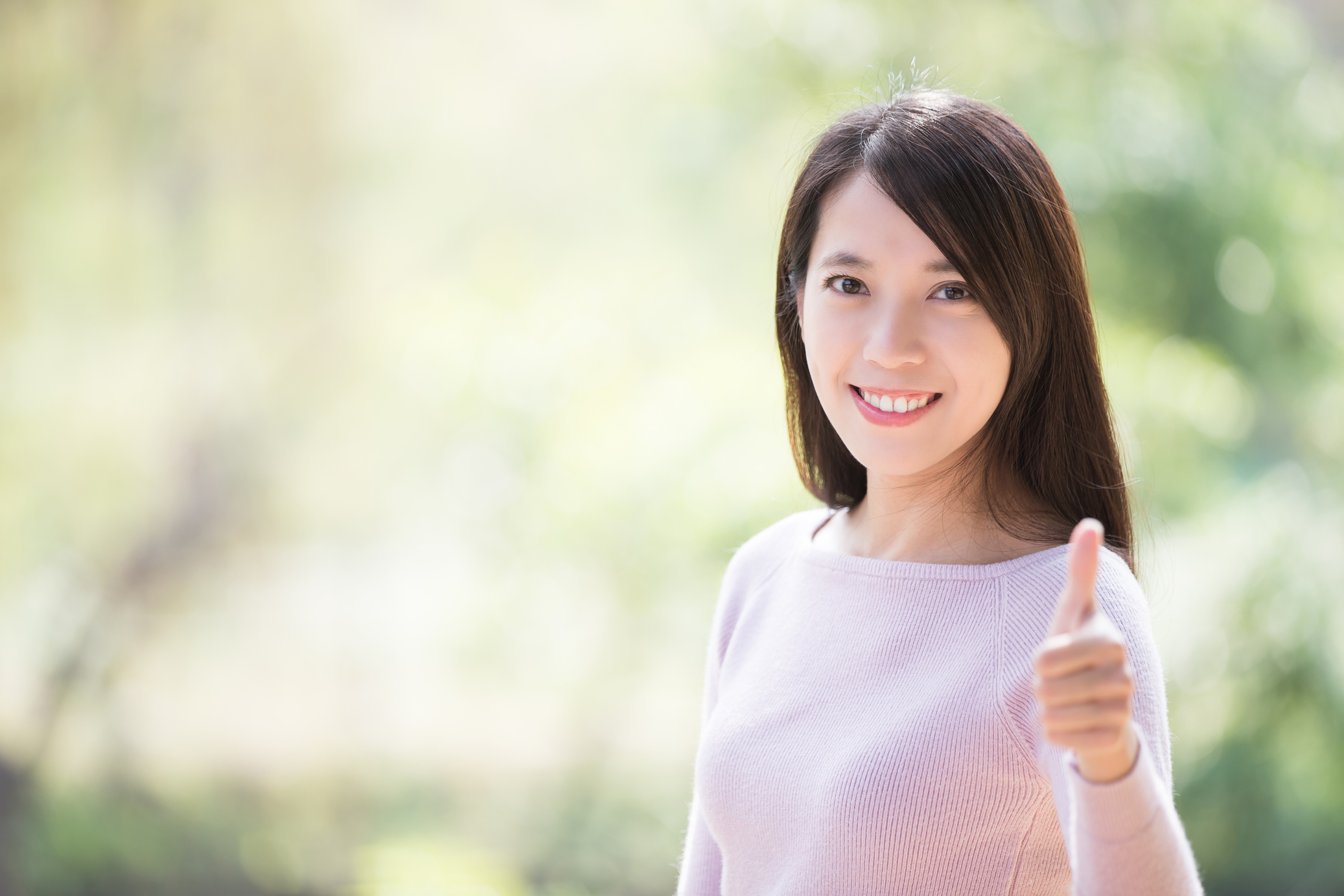 Young Woman Smile Thumb up